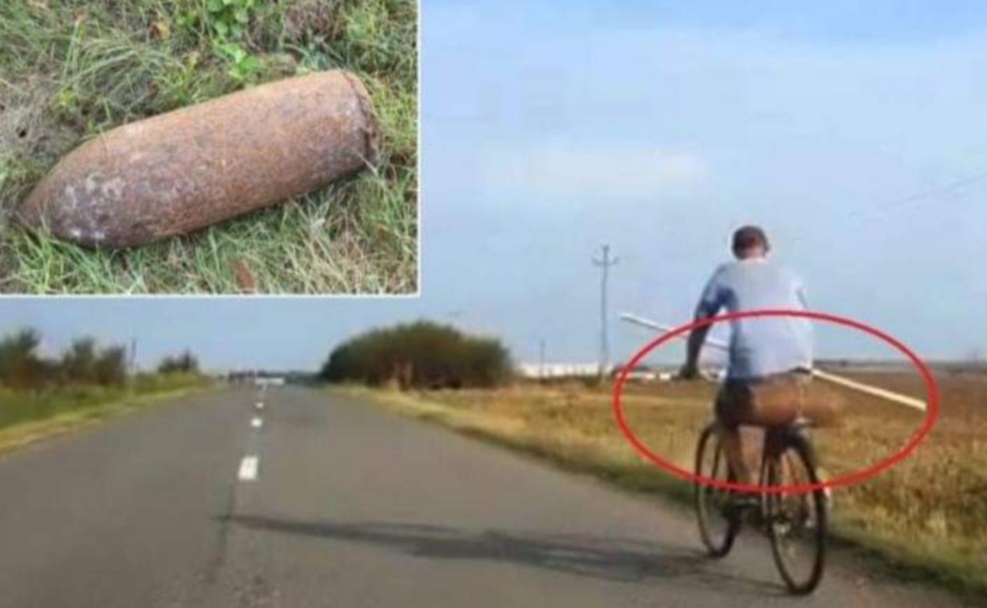 Arădean filmat în timp ce căra pe bicicletă o bombă neexplodată de 50 de kg. La prima groapa în asfalt, va deveni inventatorul bicicletei cu reacție!